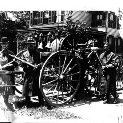 Historic photograph of Rockville Centre firefighters with early horse-drawn fire apparatus-Circa 1895.