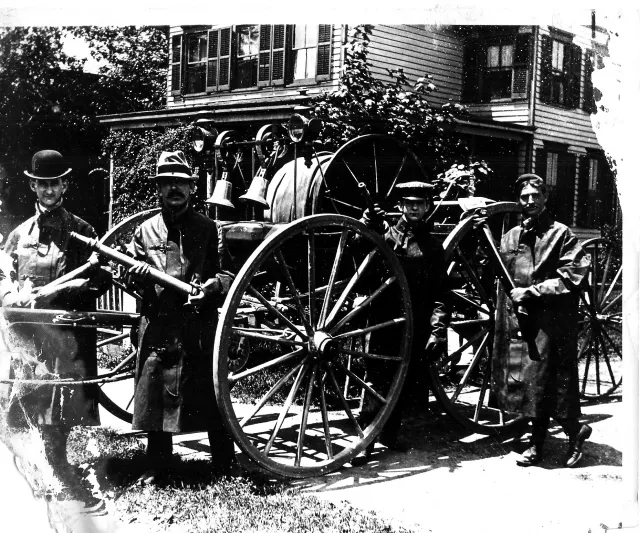 Historic photograph of Rockville Centre firefighters with early horse-drawn fire apparatus-Circa 1895.