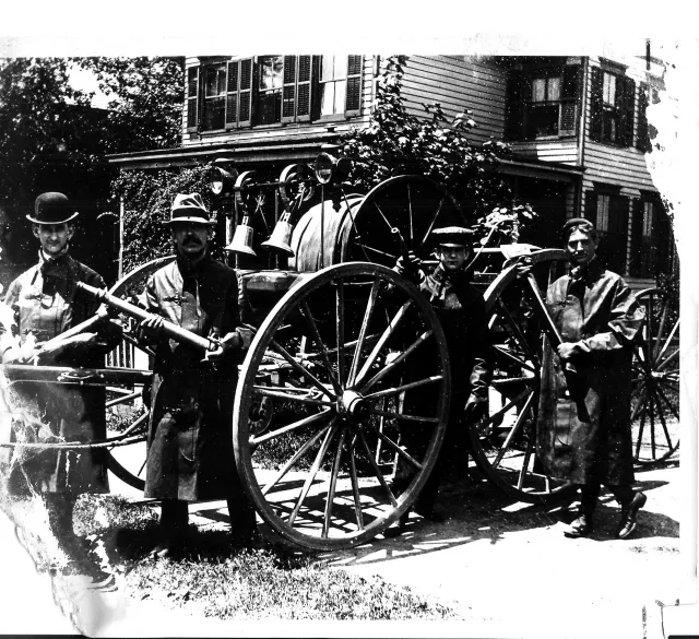 Historic photograph of Rockville Centre firefighters with early horse-drawn fire apparatus-Circa 1895.