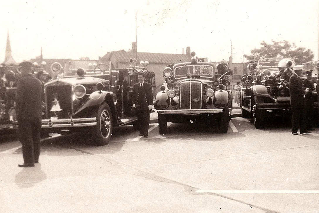 Historic photograph of Rockville Centre fire apparatus and firefighters.